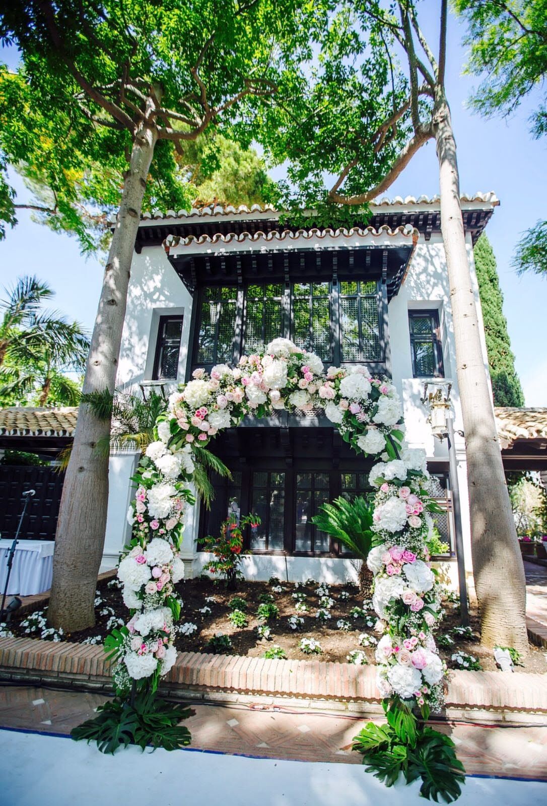 Floral wedding arch in a garden